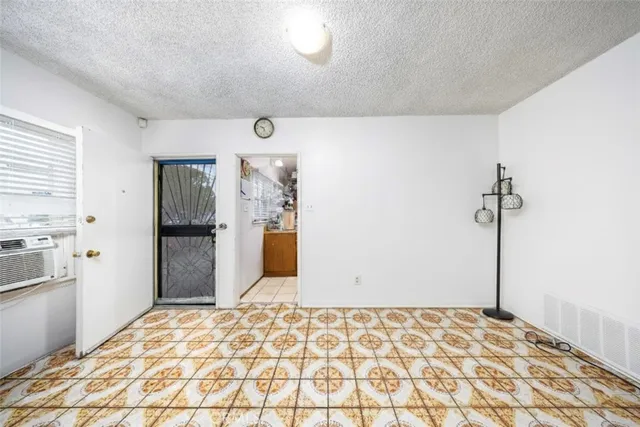 a bedroom with a bed and a cabinets