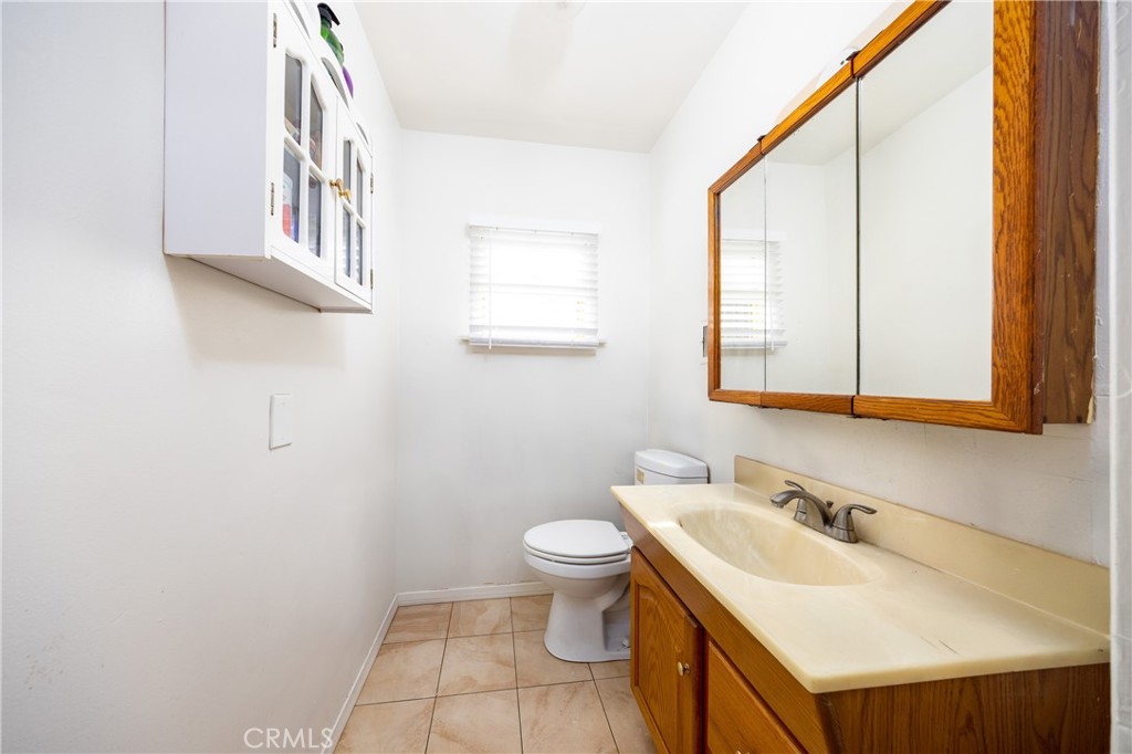 12203 Klingerman Street El Monte, CA 91732 - Photo 10 of 21 a bathroom with a sink and a toilet