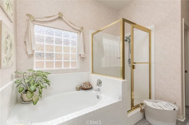 a bathroom with a bathtub and a shower