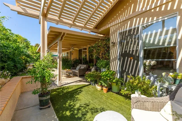 a view of a chair and tables front of house
