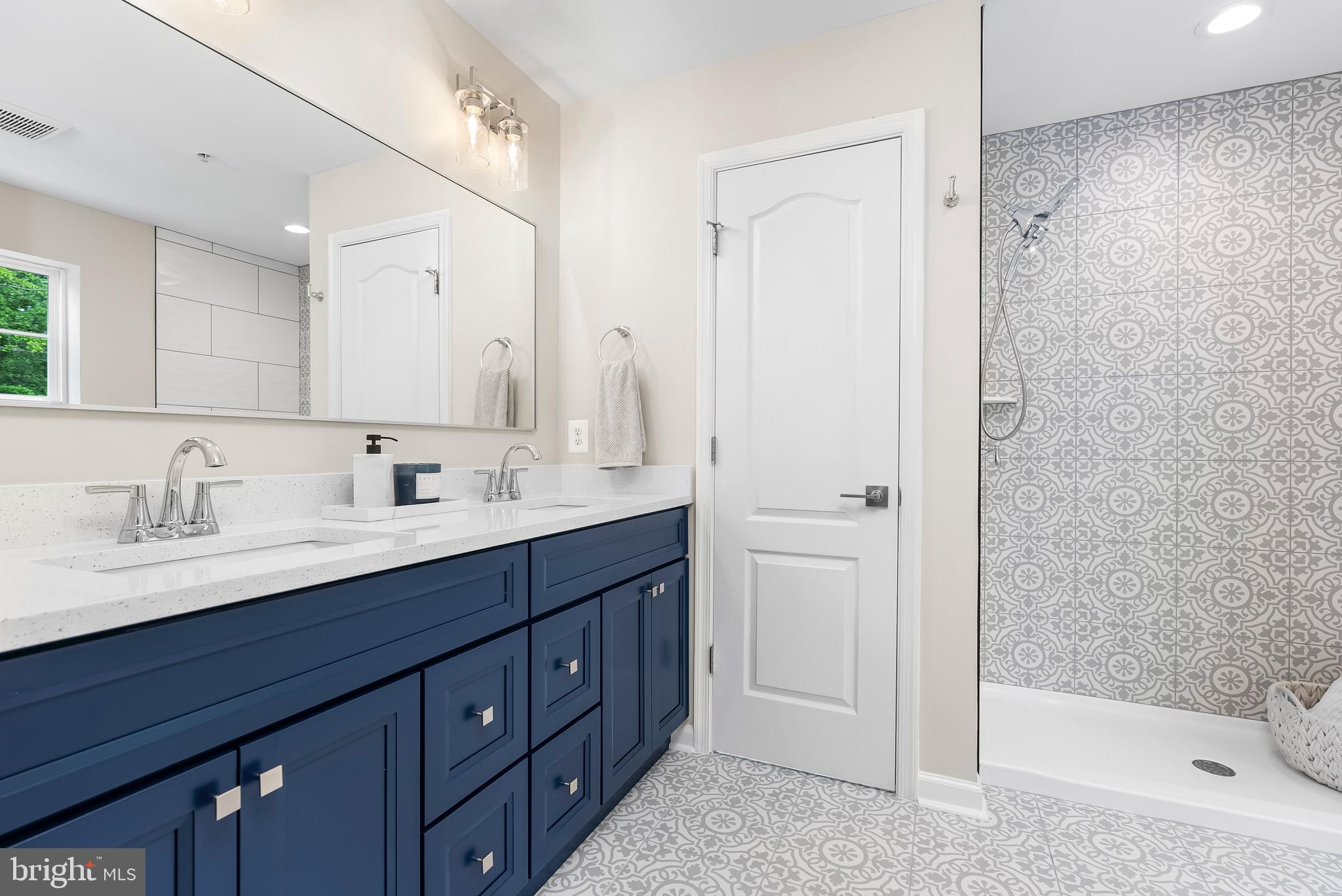 913 Sandy Run Road Middle River, MD 21220 - Photo 23 of 40 a bathroom with a tub sink shower and mirror