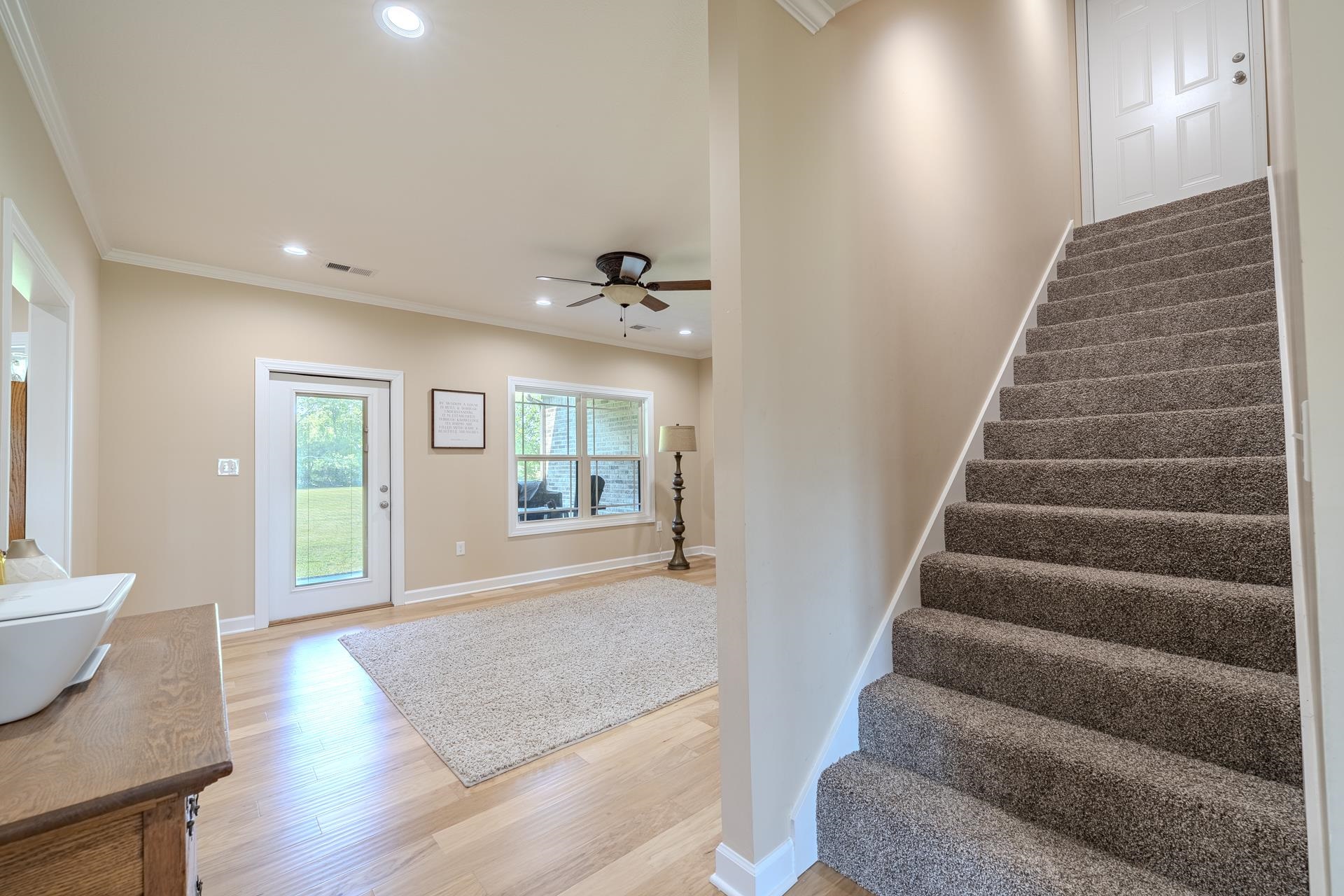 170 Kirk Cove Adamsville, TN 38310 - Photo 11 of 39 Foyer entrance with recessed lighting, light wood-style floors, crown molding, and a ceiling fan