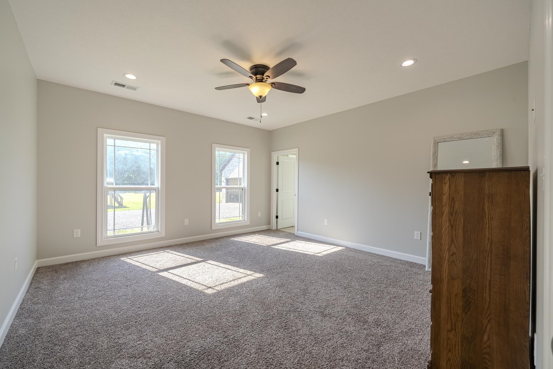 170 Kirk Cove Adamsville, TN 38310 - Photo 15 of 39 Carpeted spare room with ceiling fan and recessed lighting