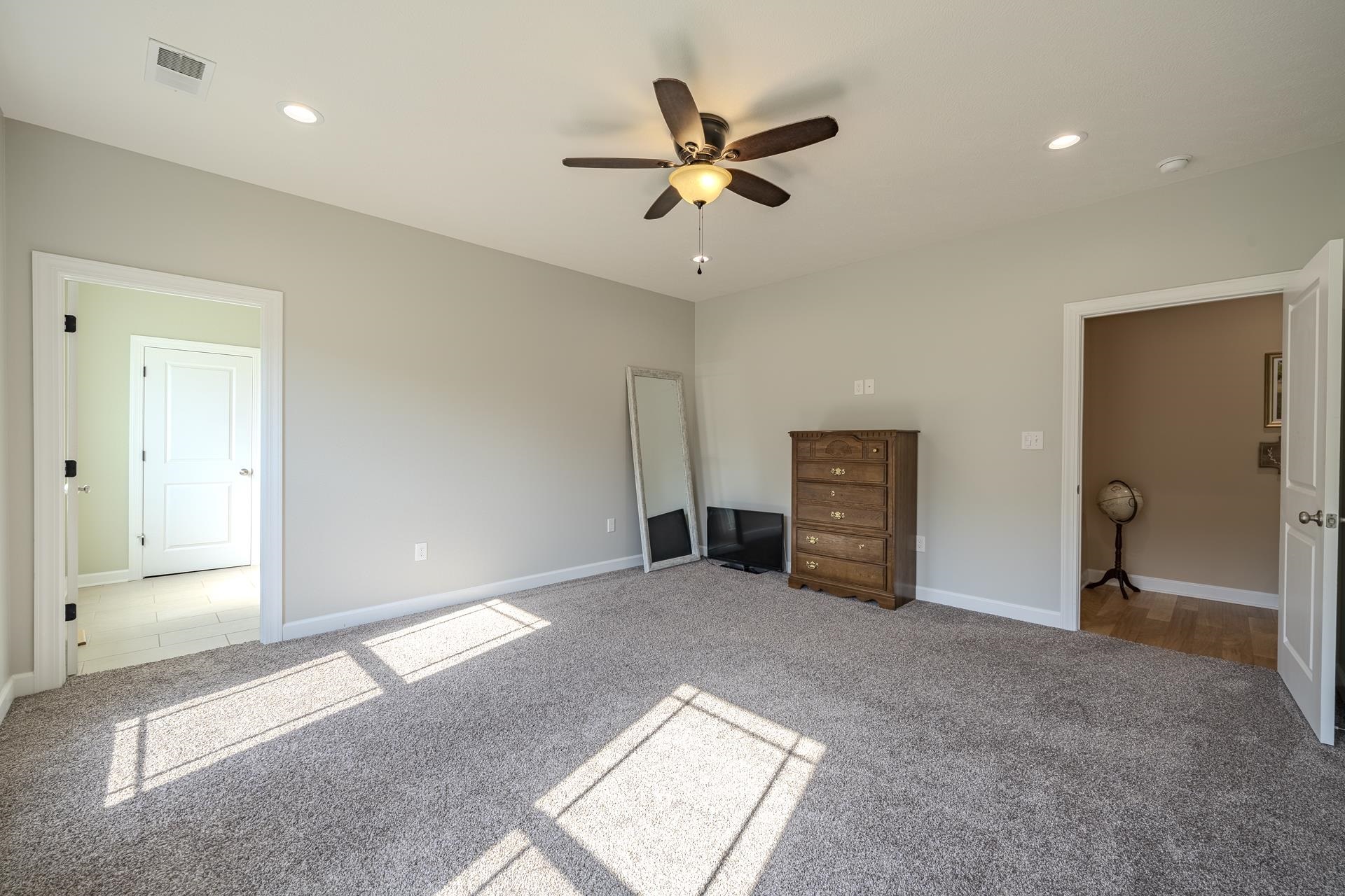 170 Kirk Cove Adamsville, TN 38310 - Photo 16 of 39 Unfurnished bedroom featuring carpet, a ceiling fan, and recessed lighting