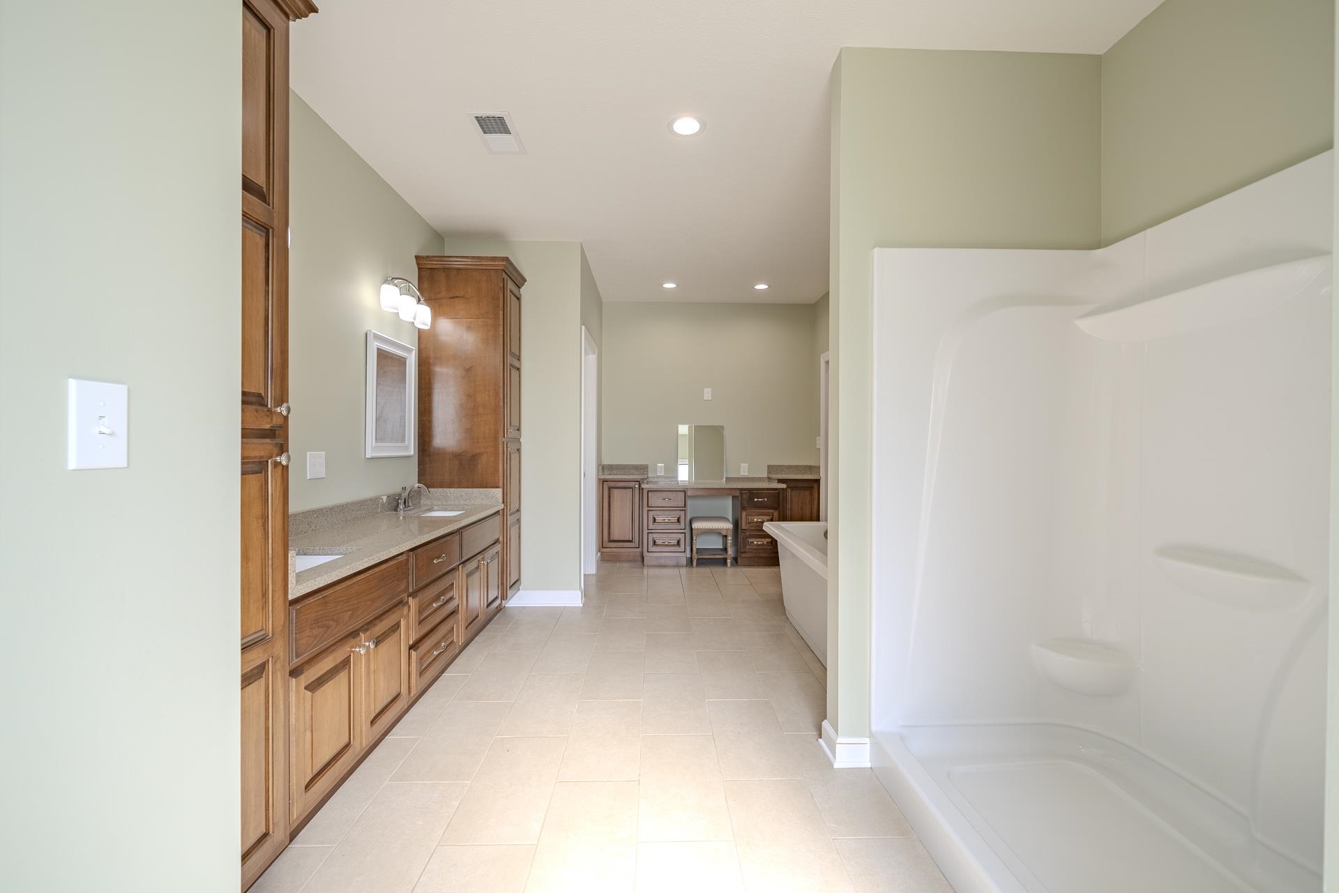 170 Kirk Cove Adamsville, TN 38310 - Photo 17 of 39 Full bathroom featuring double vanity, a soaking tub, recessed lighting, walk in shower, and light tile patterned floors