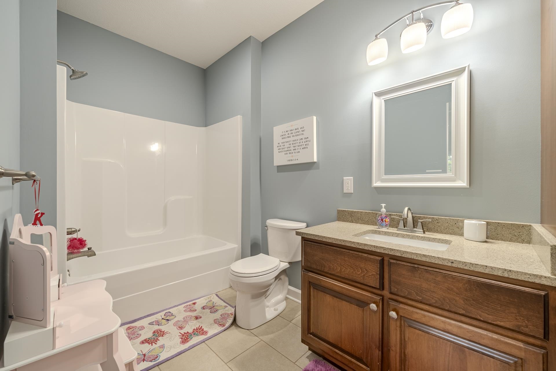 170 Kirk Cove Adamsville, TN 38310 - Photo 22 of 39 Full bath featuring vanity, washtub / shower combination, and light tile patterned floors