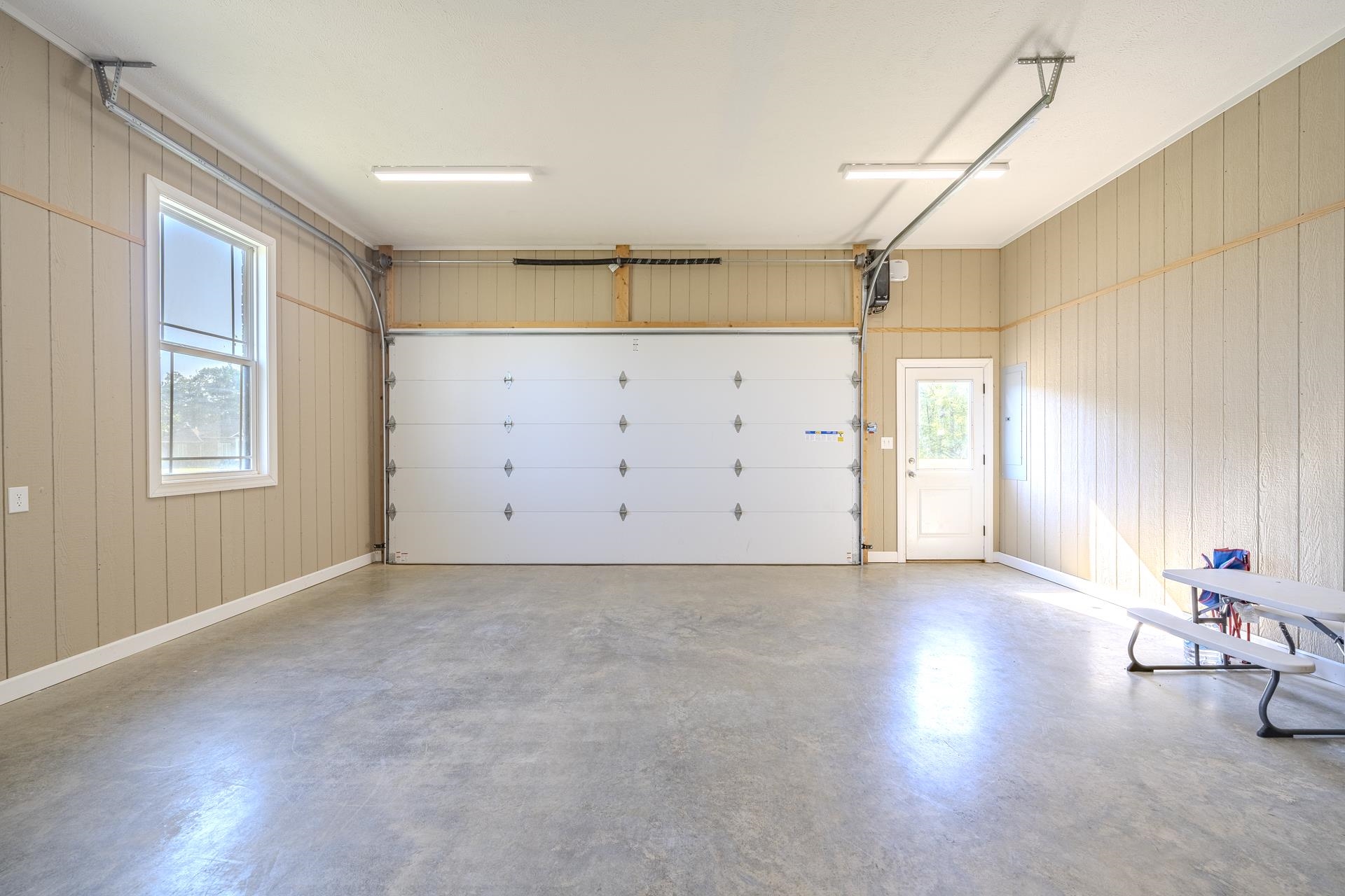 170 Kirk Cove Adamsville, TN 38310 - Photo 29 of 39 Garage with wood walls and baseboards