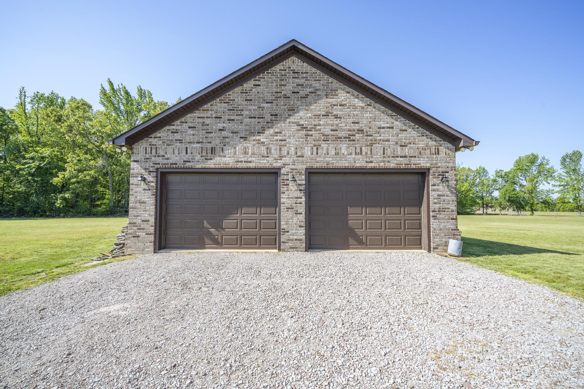 170 Kirk Cove Adamsville, TN 38310 - Photo 30 of 39 Garage featuring driveway