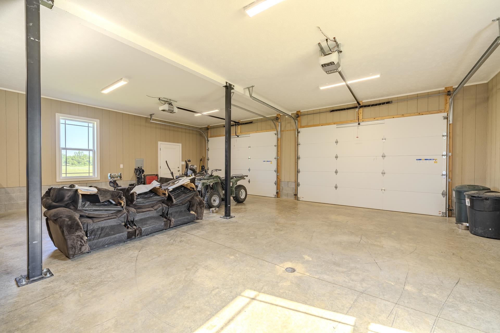 170 Kirk Cove Adamsville, TN 38310 - Photo 31 of 39 Garage featuring a garage door opener