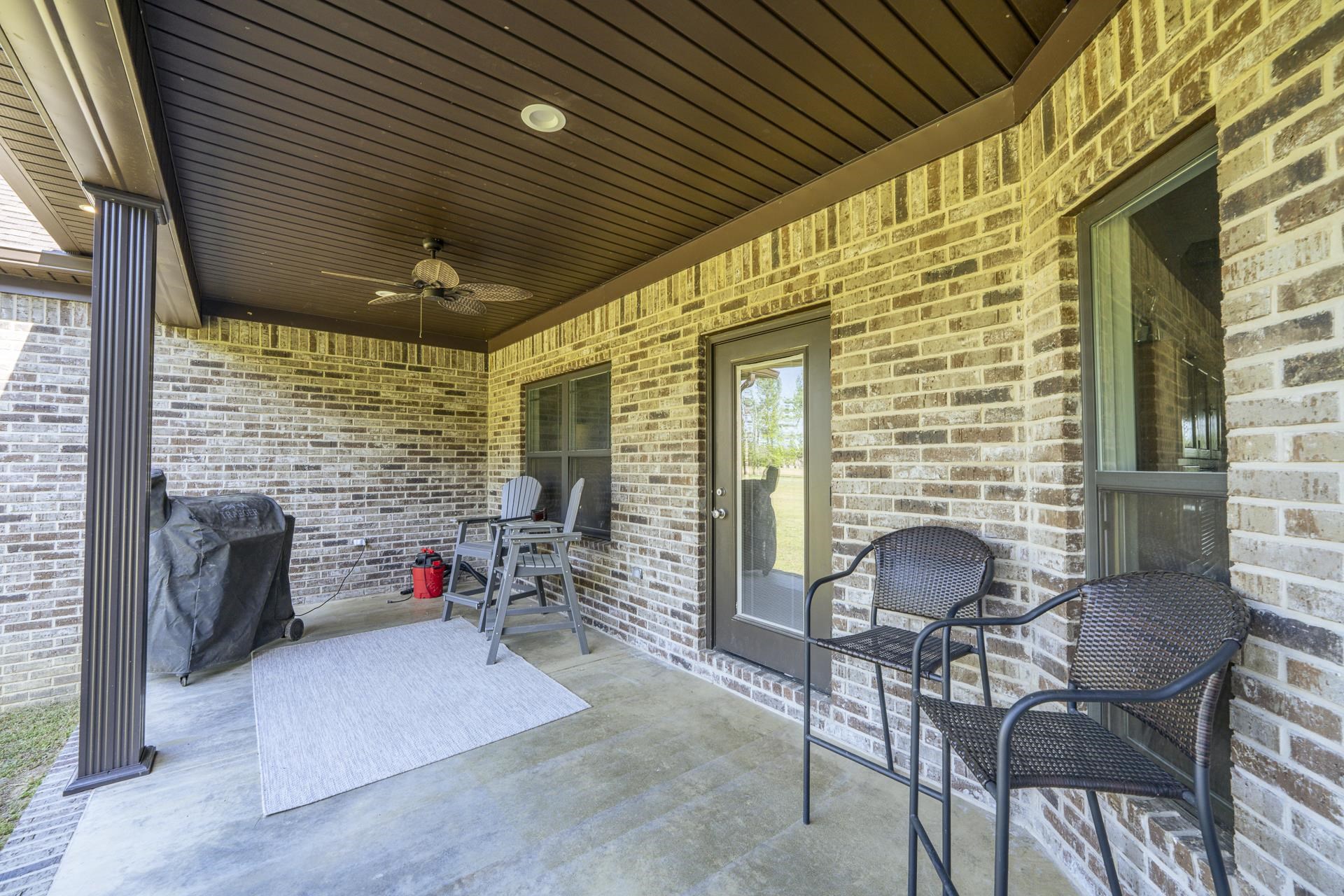 170 Kirk Cove Adamsville, TN 38310 - Photo 34 of 39 View of patio with a ceiling fan and a grill