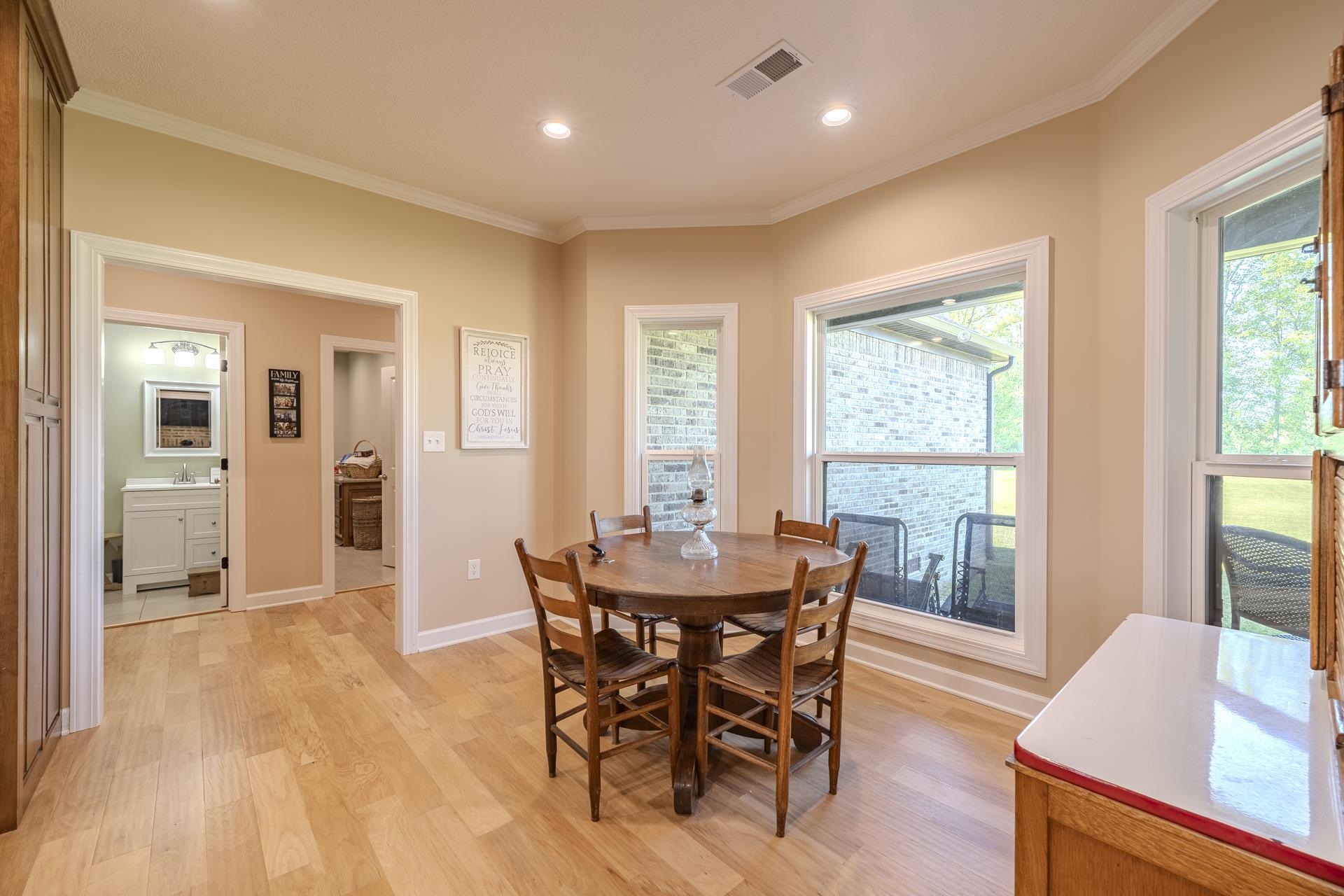 170 Kirk Cove Adamsville, TN 38310 - Photo 8 of 39 Dining area with crown molding, light wood-type flooring, and recessed lighting