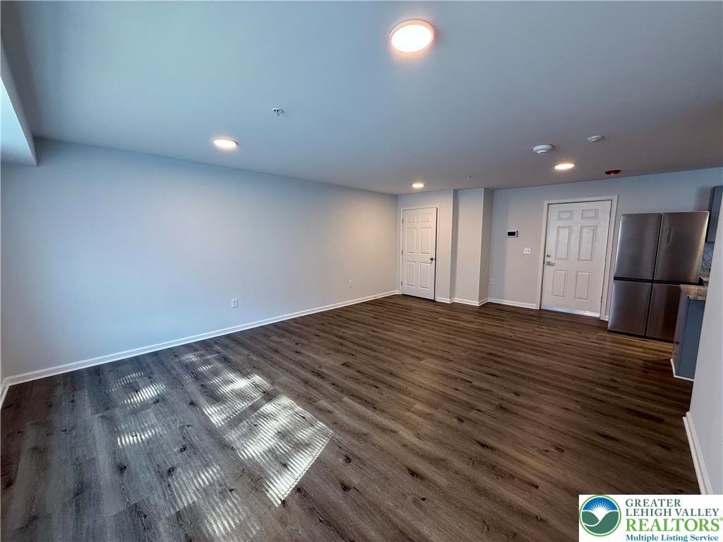 938 East 4th Street, Unit G03 Bethlehem, PA 18015 - Photo 14 of 30 a view of empty room with wooden floor
