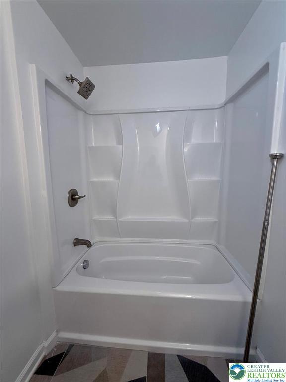 938 East 4th Street, Unit G03 Bethlehem, PA 18015 - Photo 27 of 30 a bathroom with a bathtub and a shower
