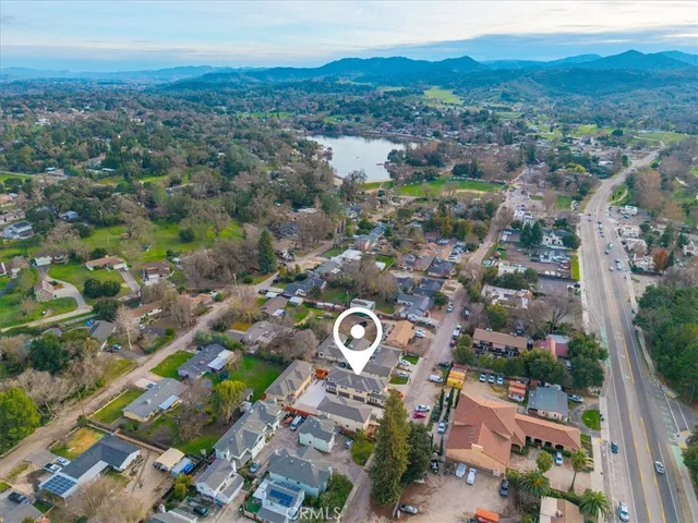 an aerial view of a house with a yard