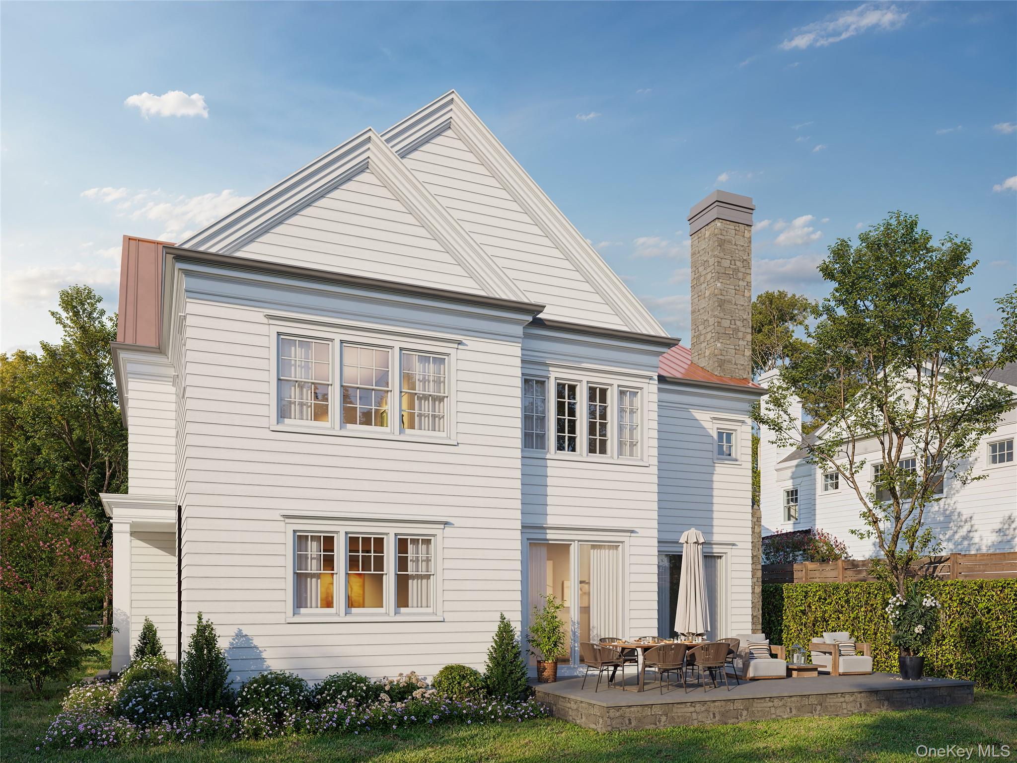 87 Carthage Road Scarsdale, NY 10583 - Photo 2 of 7 a front view of a house with a yard