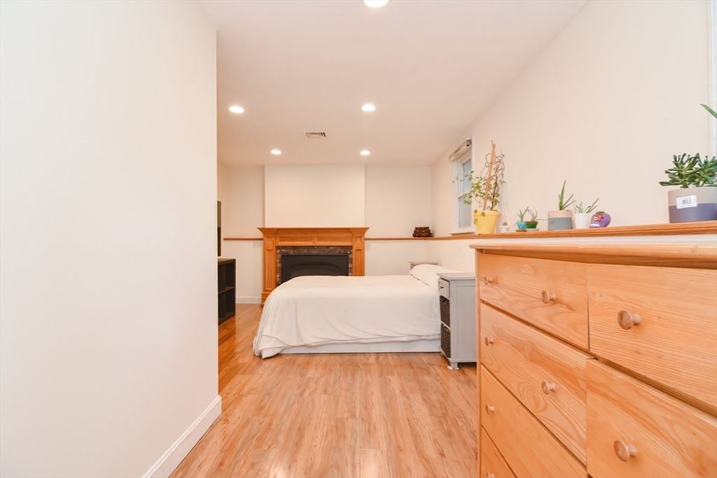 16 August Drive Framingham, MA 01701 - Photo 16 of 27 a room with a bed and a dressers