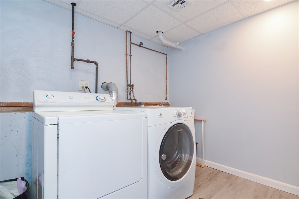 16 August Drive Framingham, MA 01701 - Photo 23 of 27 a utility room with dryer and washer