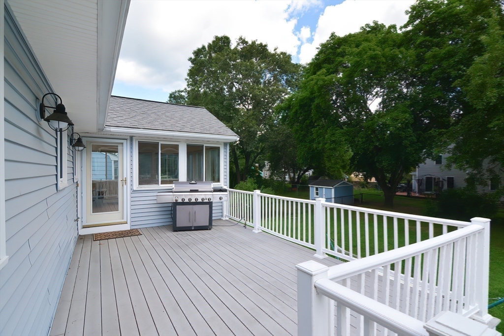 16 August Drive Framingham, MA 01701 - Photo 24 of 27 a view of a deck with couches and wooden floor