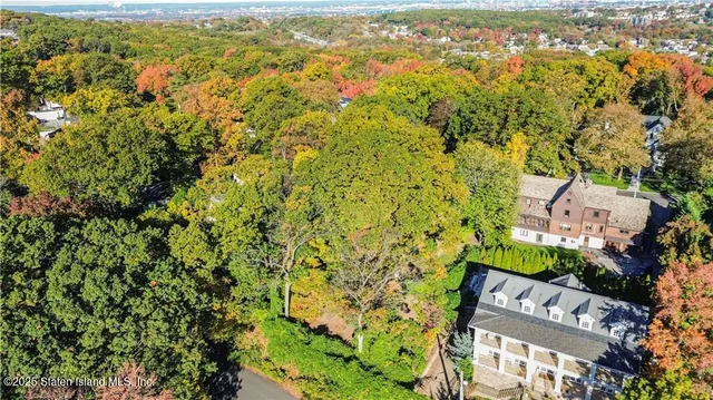 an aerial view of houses with yard