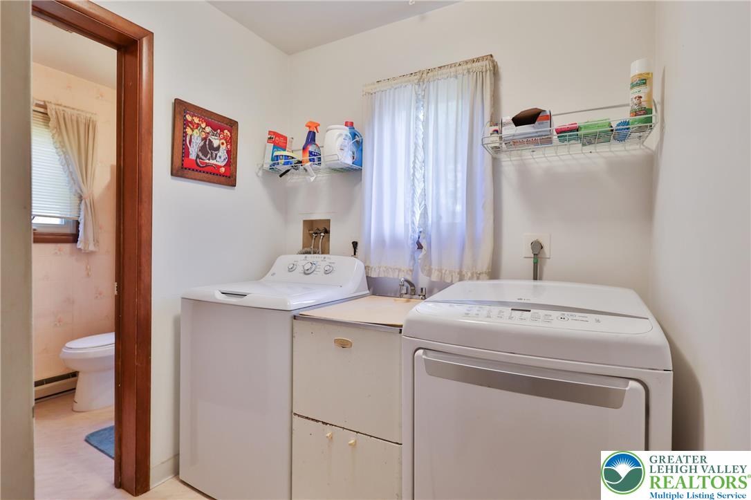 7933 Trails End Fogelsville, PA 18051 - Photo 14 of 32 a utility room with dryer and washer