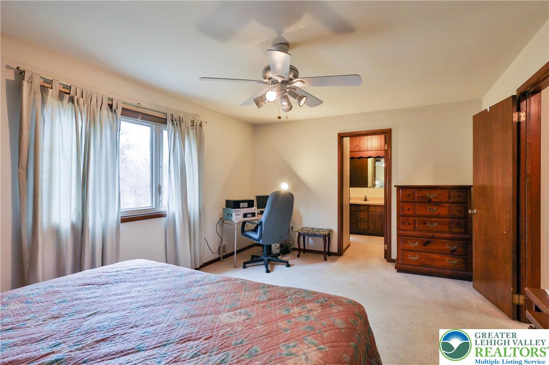 7933 Trails End Fogelsville, PA 18051 - Photo 16 of 32 a bedroom with a bed and furniture