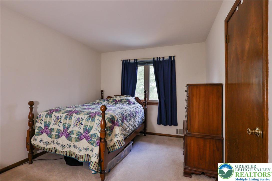 7933 Trails End Fogelsville, PA 18051 - Photo 17 of 32 a bedroom with a bed and a window