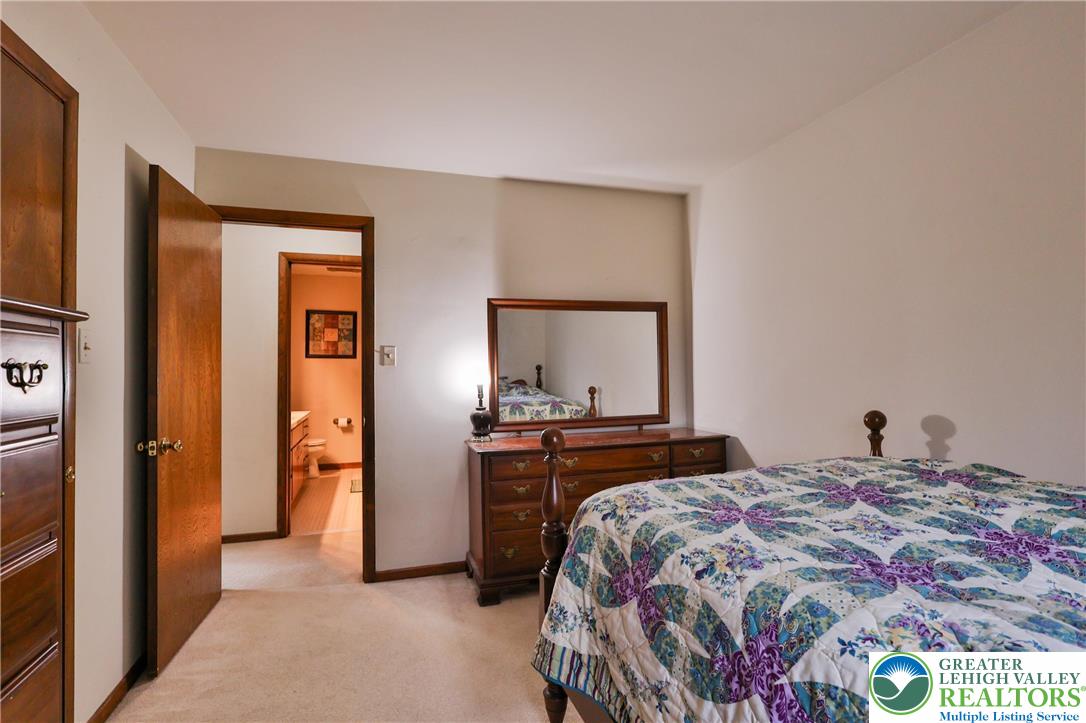 7933 Trails End Fogelsville, PA 18051 - Photo 18 of 32 a bedroom with a bed and a dresser