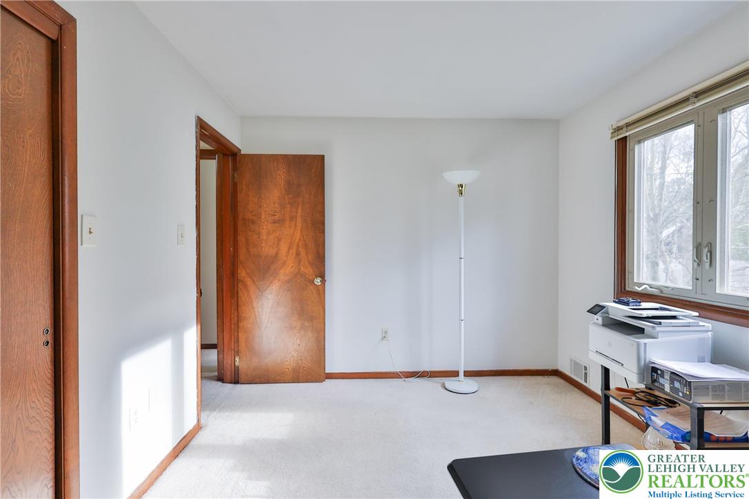7933 Trails End Fogelsville, PA 18051 - Photo 19 of 32 a view of room with window and wooden floor