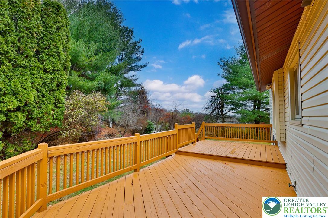 7933 Trails End Fogelsville, PA 18051 - Photo 32 of 32 a view of balcony with wooden floor and fence