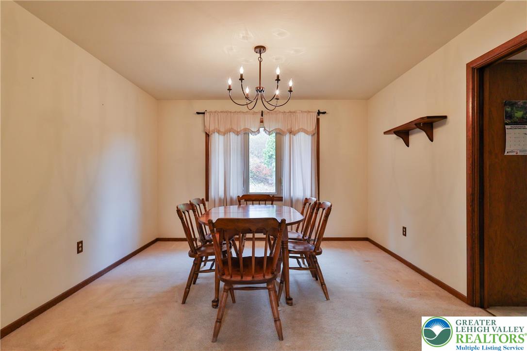 7933 Trails End Fogelsville, PA 18051 - Photo 8 of 32 a view of a dining room with furniture and window