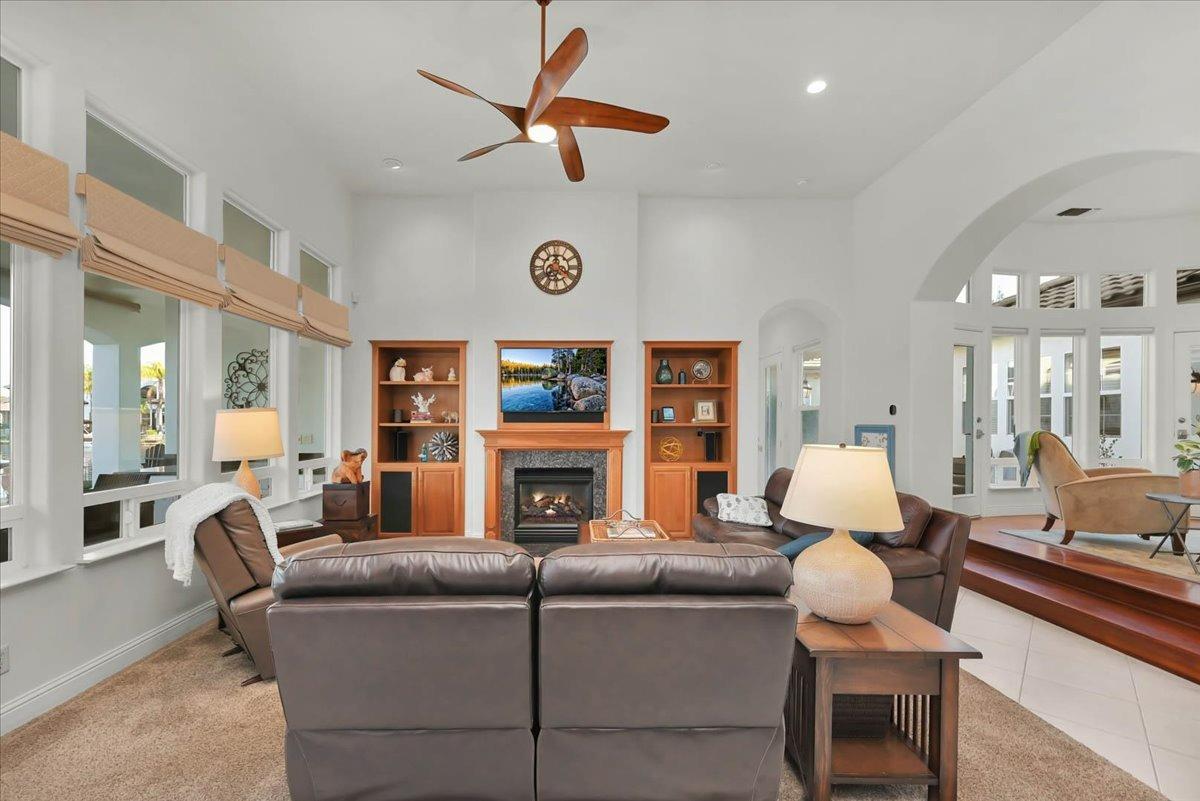 4574 North Quail Lake Drive Clovis, CA 93619 - Photo 14 of 77 a living room with fireplace furniture and a large window