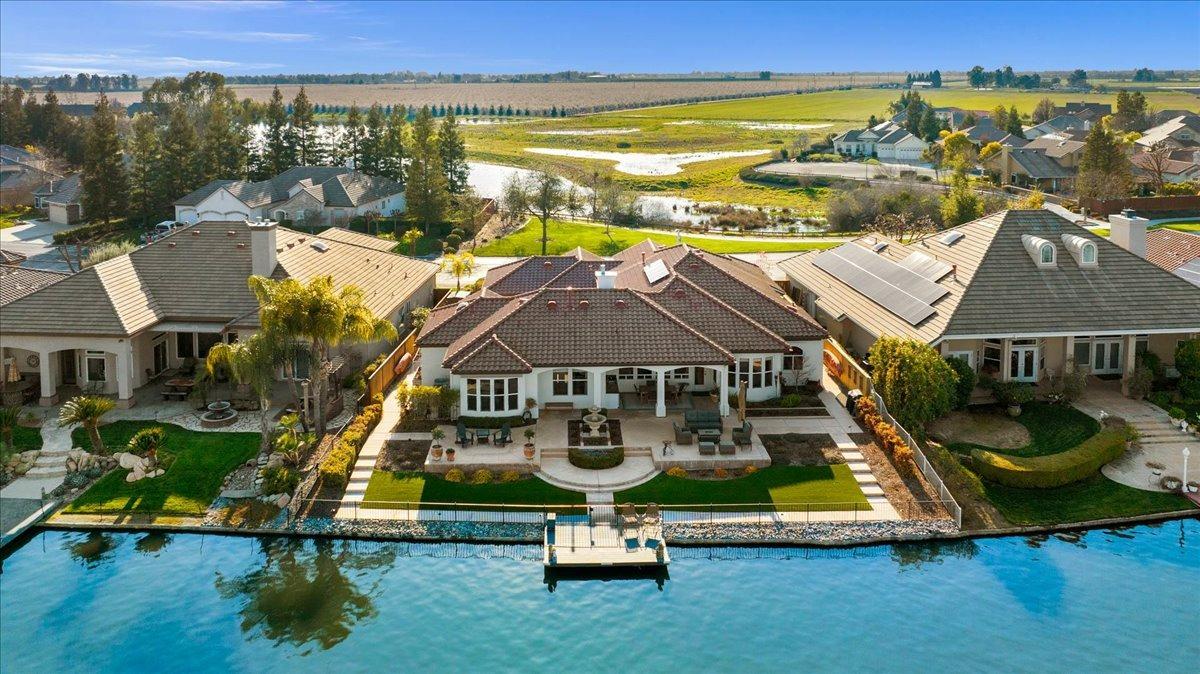 4574 North Quail Lake Drive Clovis, CA 93619 - Photo 2 of 77 an aerial view of residential houses with outdoor space and swimming pool