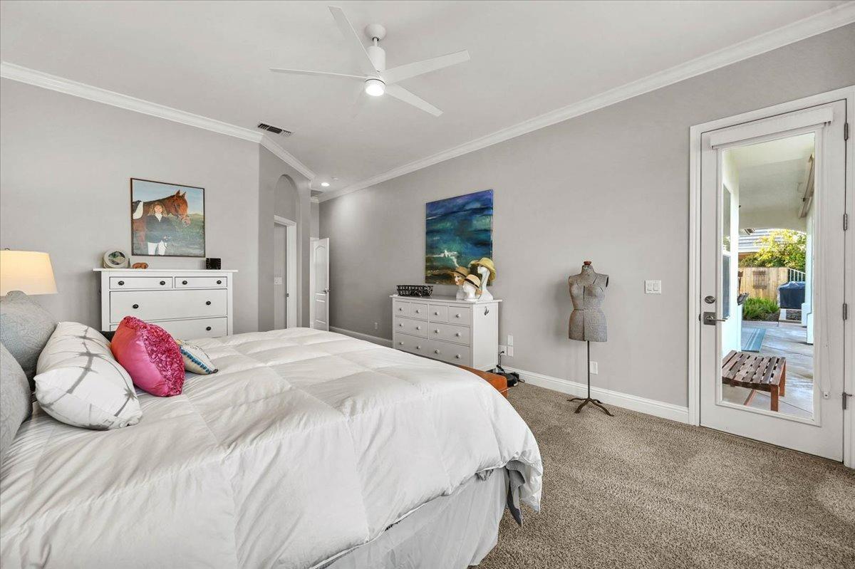 4574 North Quail Lake Drive Clovis, CA 93619 - Photo 28 of 77 a bedroom with a bed and wooden floor