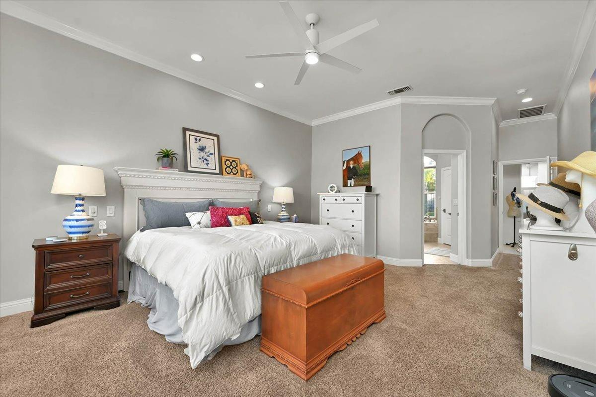 4574 North Quail Lake Drive Clovis, CA 93619 - Photo 29 of 77 a spacious bedroom with a bed and a lamp