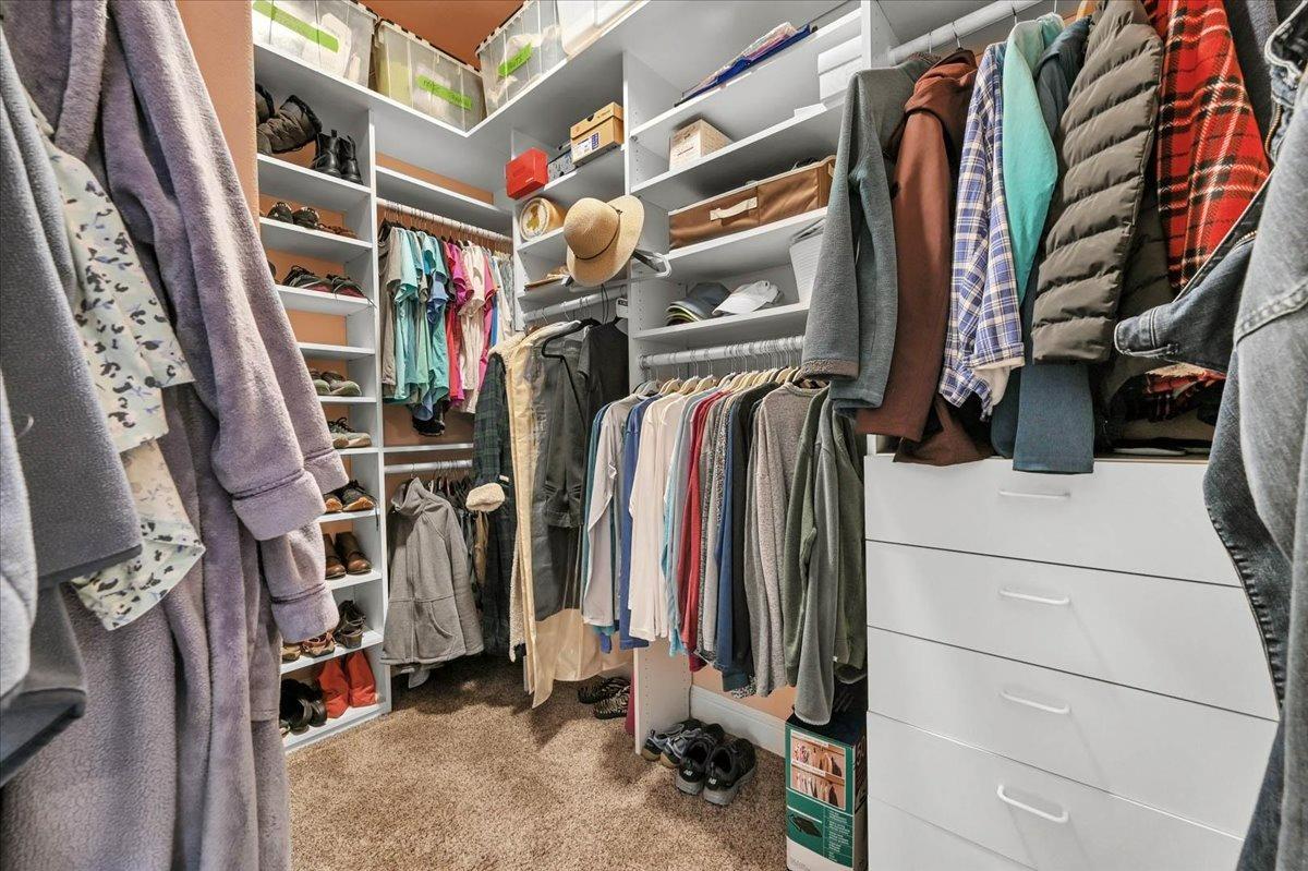 4574 North Quail Lake Drive Clovis, CA 93619 - Photo 34 of 77 a view of walk in closet with clothes and shoes
