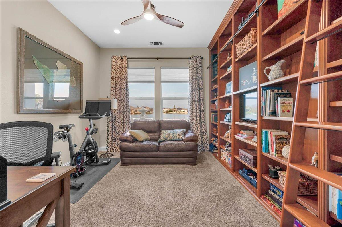 4574 North Quail Lake Drive Clovis, CA 93619 - Photo 41 of 77 a view of a livingroom with workspace and a window