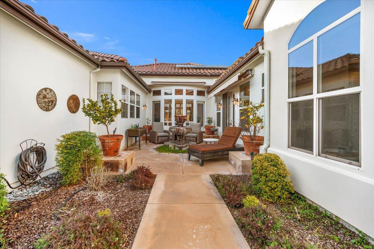 4574 North Quail Lake Drive Clovis, CA 93619 - Photo 45 of 77 a view of a patio with couches table and chairs and potted plants