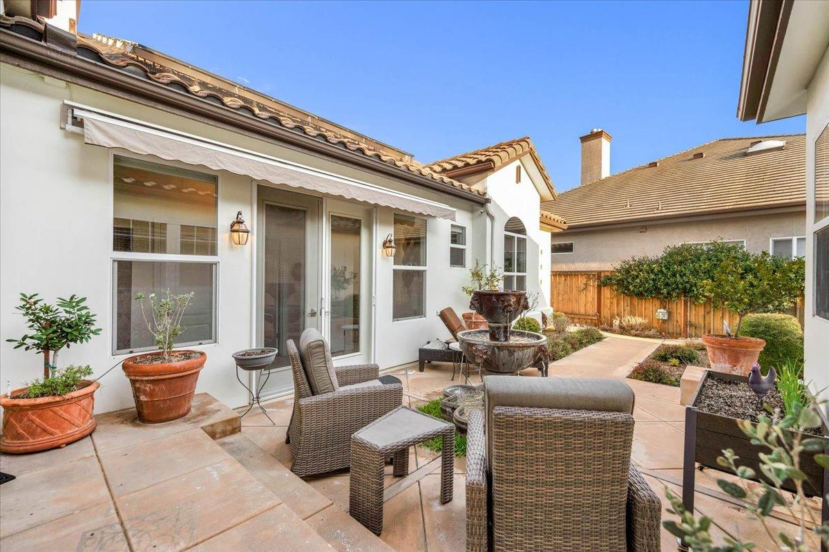 4574 North Quail Lake Drive Clovis, CA 93619 - Photo 47 of 77 a view of a patio with couches chairs and potted plants