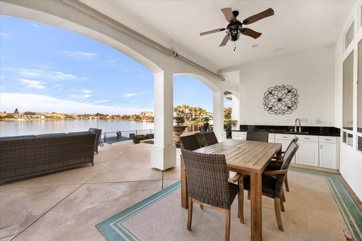 4574 North Quail Lake Drive Clovis, CA 93619 - Photo 48 of 77 a dining room with furniture and a floor to ceiling window
