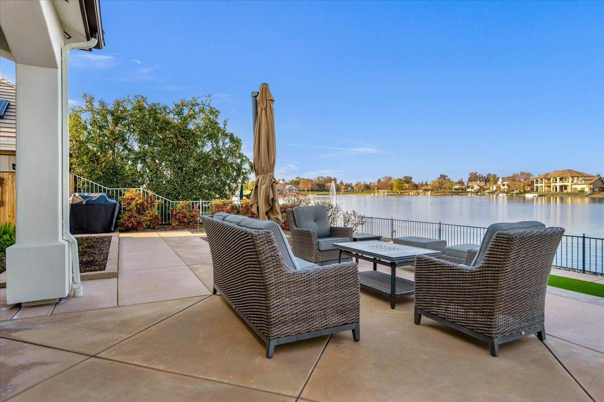 4574 North Quail Lake Drive Clovis, CA 93619 - Photo 51 of 77 a roof deck with outdoor seating and city view
