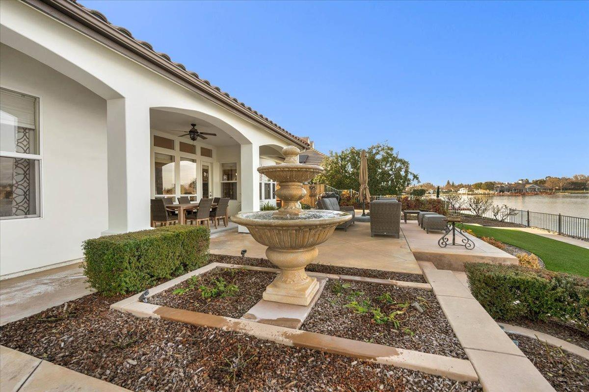 4574 North Quail Lake Drive Clovis, CA 93619 - Photo 54 of 77 a view of a swimming pool with outdoor seating and plants