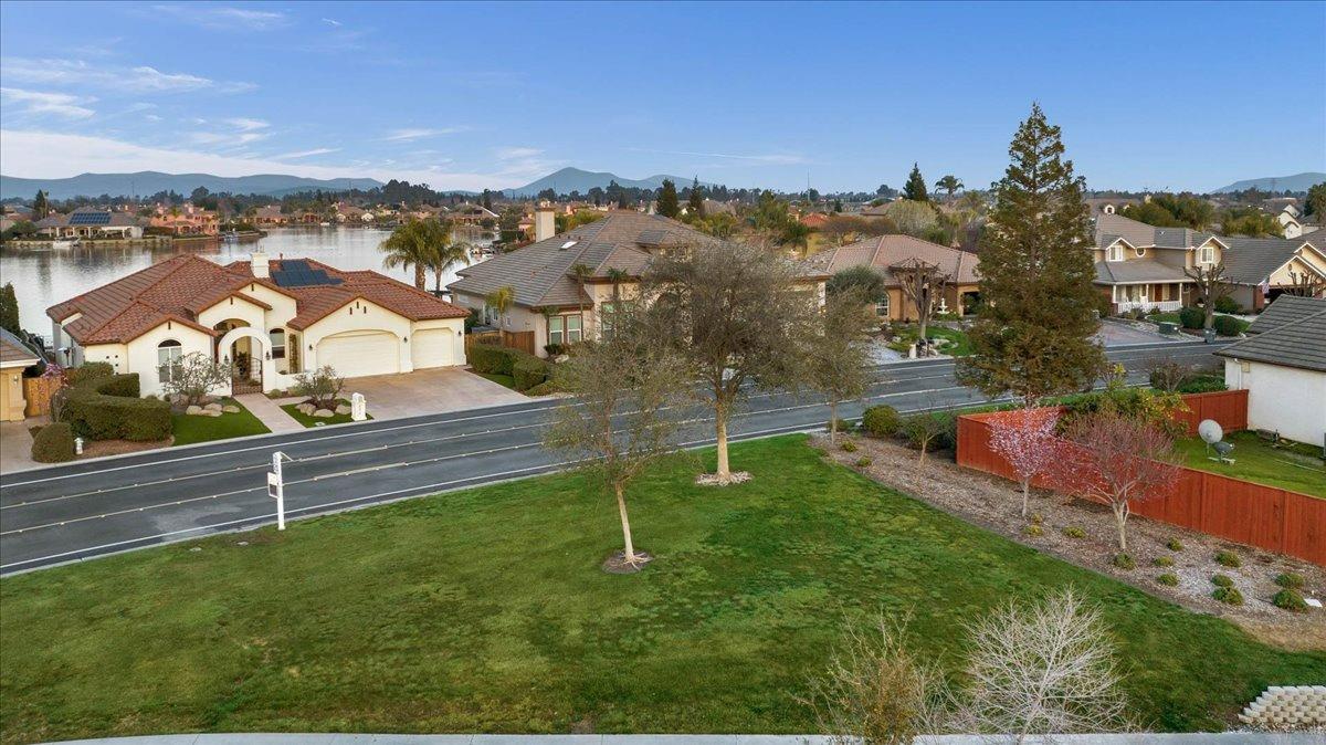 4574 North Quail Lake Drive Clovis, CA 93619 - Photo 61 of 77 an aerial view of residential houses with outdoor space and trees