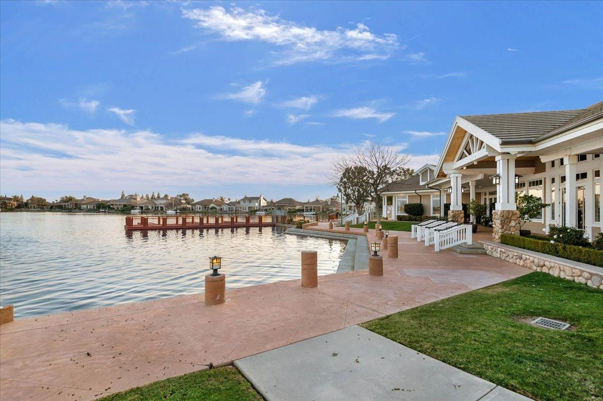 4574 North Quail Lake Drive Clovis, CA 93619 - Photo 70 of 77 a view of a lake with a table and chairs