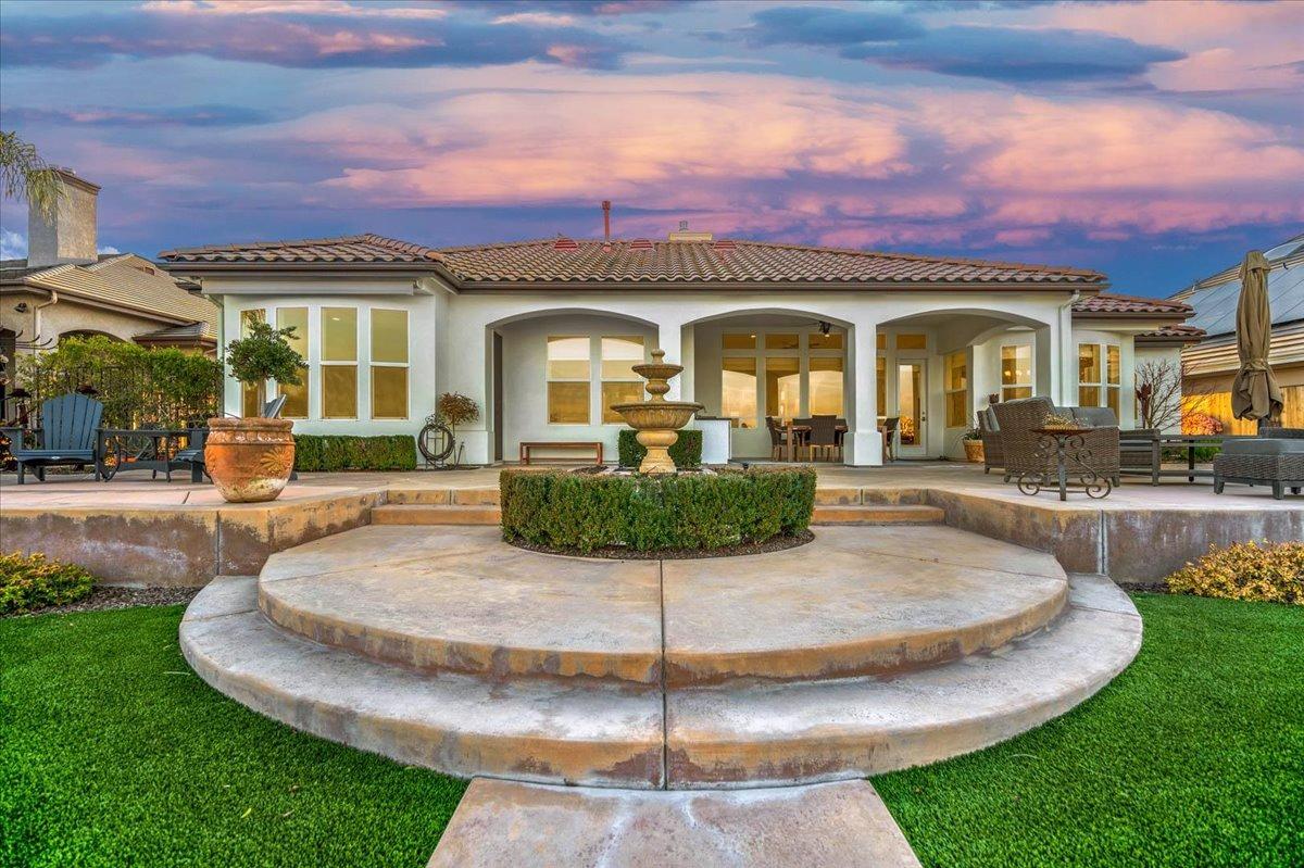 4574 North Quail Lake Drive Clovis, CA 93619 - Photo 76 of 77 a view of a house with a swimming pool