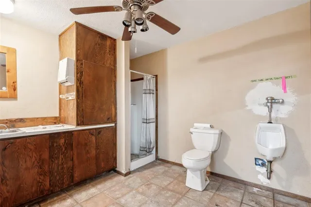 an aerial view of residential houses with outdoor space and swimming pool