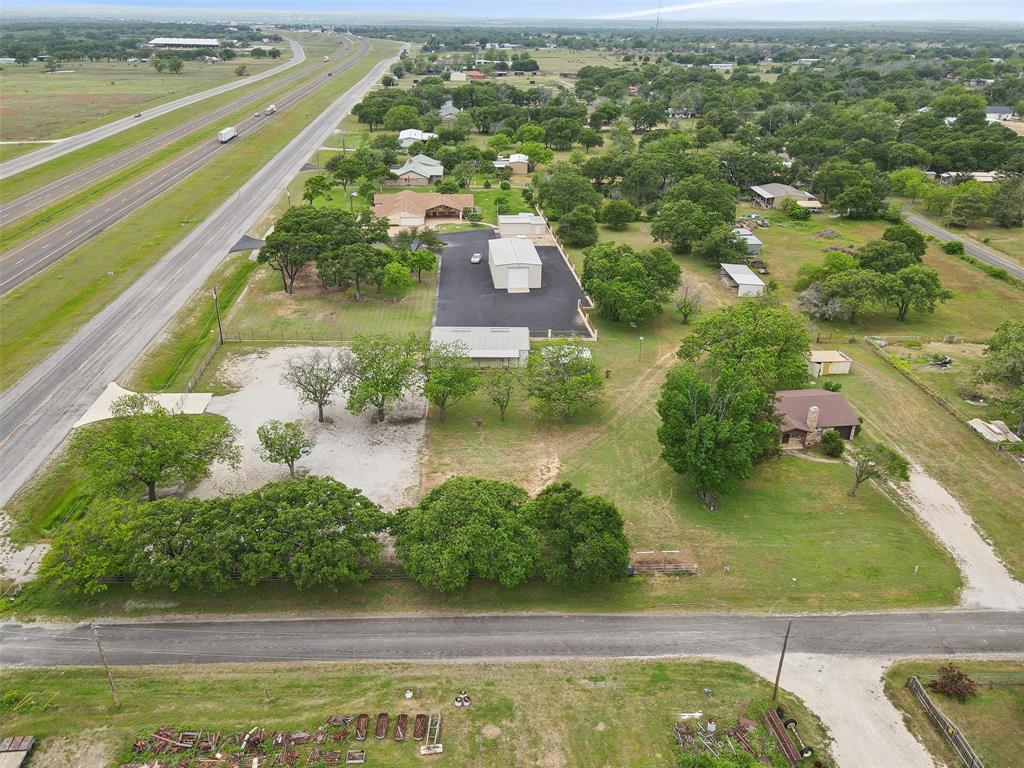 8740 Interstate 20 Eastland, TX 76448 - Photo 24 of 35 an aerial view of residential houses with outdoor space and swimming pool