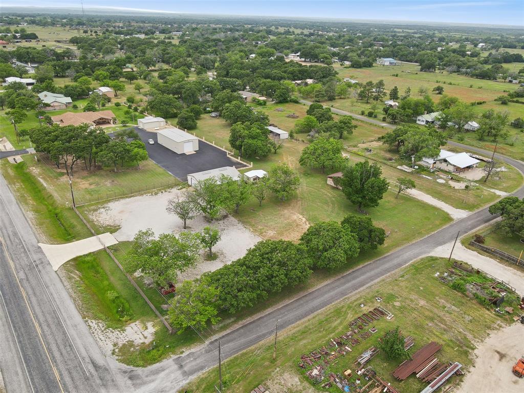 8740 Interstate 20 Eastland, TX 76448 - Photo 25 of 35 an aerial view of residential houses with outdoor space and river