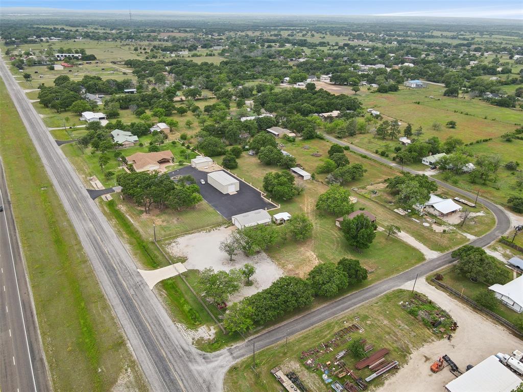 8740 Interstate 20 Eastland, TX 76448 - Photo 26 of 35 an aerial view of residential houses with outdoor space