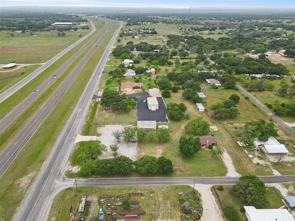 8740 Interstate 20 Eastland, TX 76448 - Photo 27 of 35 an aerial view of residential houses with outdoor space