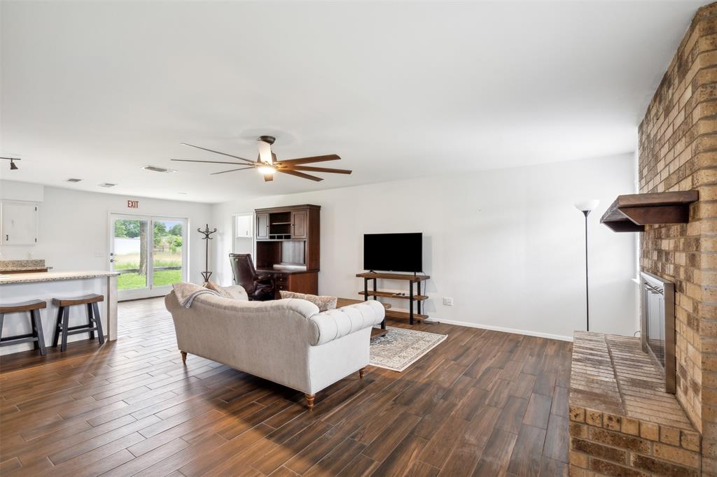 8740 Interstate 20 Eastland, TX 76448 - Photo 7 of 35 a living room with furniture and a wooden floor